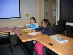 Children colouring peace rings.